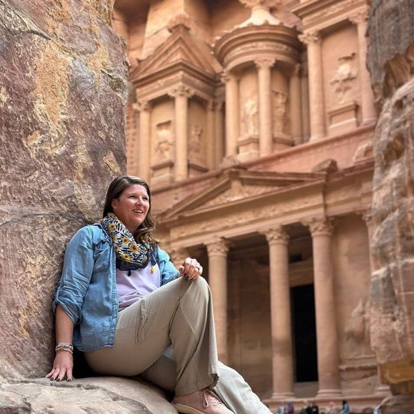 Bri Hill sitting below the Treasury at Petra, Jordan